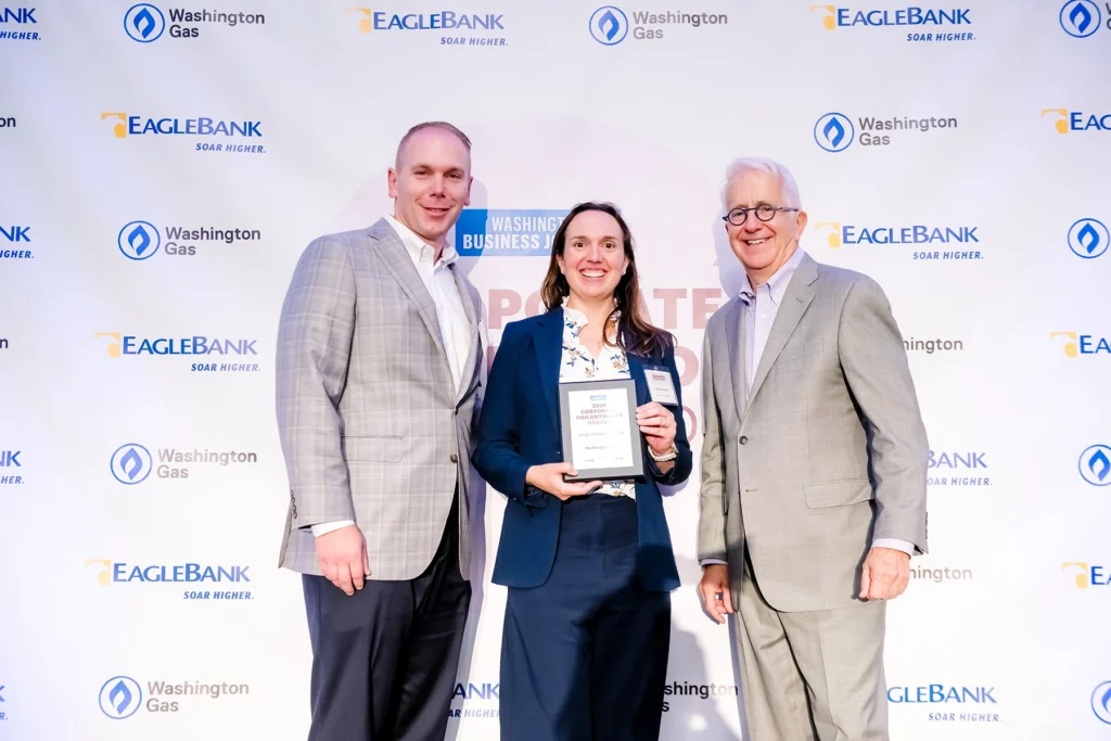 Our News 2 Jason greenawalt and kaitlin ekechuku accepting the washington business journal corporate philanthropy award on behalf of nakupuna